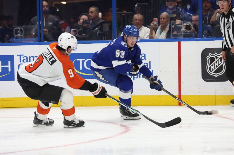 Nov 7, 2024; Tampa, Florida, USA; Tampa Bay Lightning center Gage Goncalves (93) skates with the puck as Philadelphia Flyers defenseman Jamie Drysdale (9) during the third period at Amalie Arena. Mandatory Credit: Kim Klement Neitzel-Imagn Images