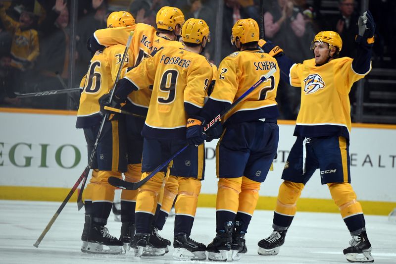 Dec 12, 2023; Nashville, Tennessee, USA; Nashville Predators players celebrate after a goal by right wing Michael McCarron (47) during the second period against the Philadelphia Flyers at Bridgestone Arena. Mandatory Credit: Christopher Hanewinckel-USA TODAY Sports