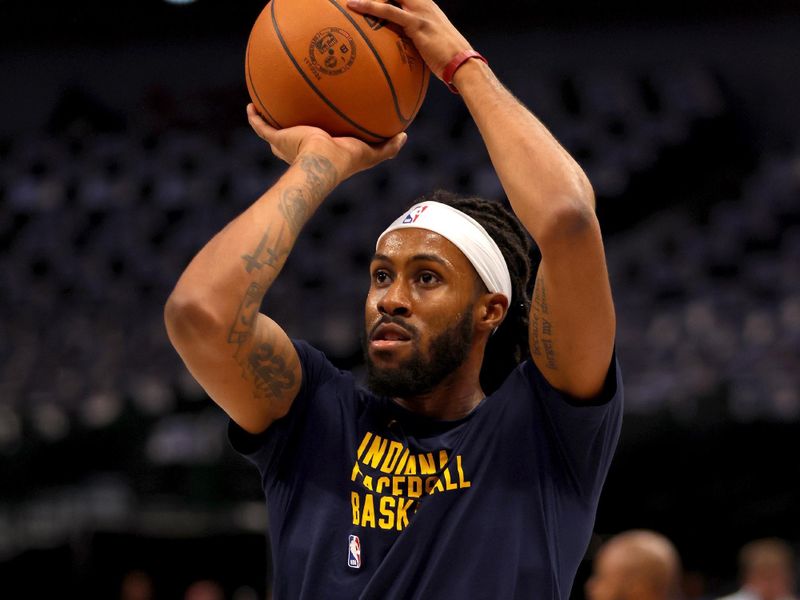 DALLAS, TEXAS - MARCH 05: Isaiah Jackson #22 of the Indiana Pacers takes a shot during warmups before the game against the Dallas Mavericks at American Airlines Center on March 05, 2024 in Dallas, Texas. NOTE TO USER: User expressly acknowledges and agrees that, by downloading and or using this photograph, User is consenting to the terms and conditions of the Getty Images License Agreement. (Photo by Tim Heitman/Getty Images)