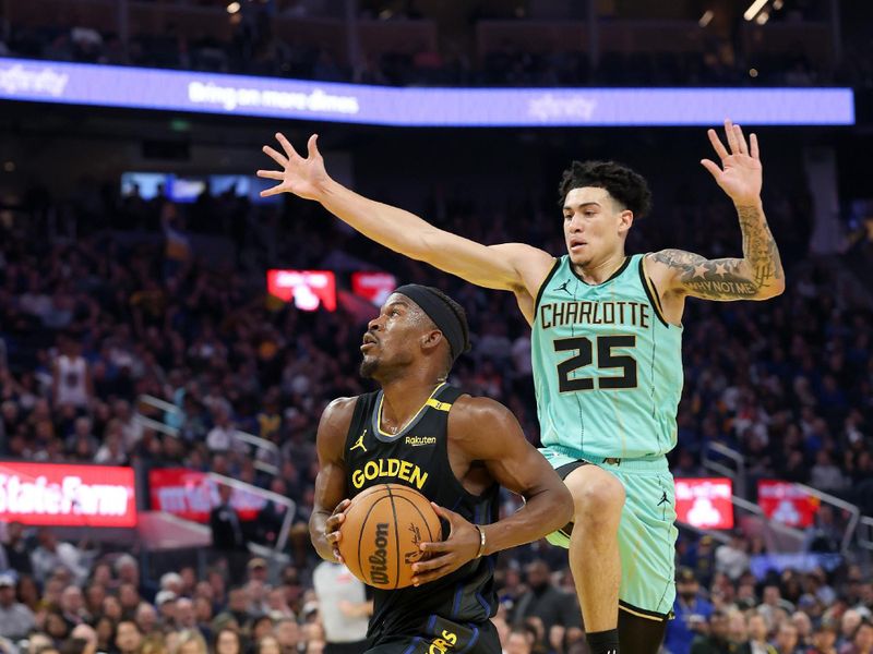 SAN FRANCISCO, CALIFORNIA - FEBRUARY 25: Jimmy Butler III #10 of the Golden State Warriors goes up for a shot on KJ Simpson #25 of the Charlotte Hornets during the first half at Chase Center on February 25, 2025 in San Francisco, California. NOTE TO USER: User expressly acknowledges and agrees that, by downloading and/or using this photograph, user is consenting to the terms and conditions of the Getty Images License Agreement.   (Photo by Ezra Shaw/Getty Images)