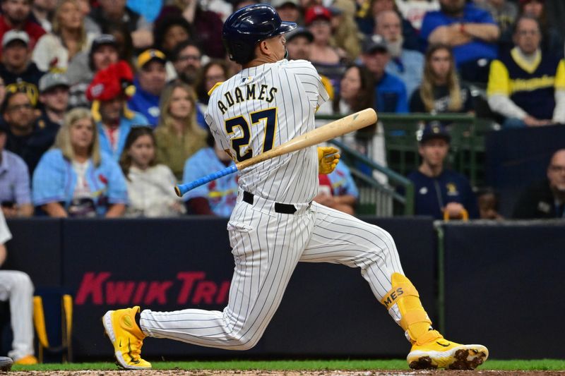 May 11, 2024; Milwaukee, Wisconsin, USA;  Milwaukee Brewers shortstop Willy Adames (27) loses his bat while swinging at a pitch against the St. Louis Cardinals in the third inning at American Family Field. Mandatory Credit: Benny Sieu-USA TODAY Sports