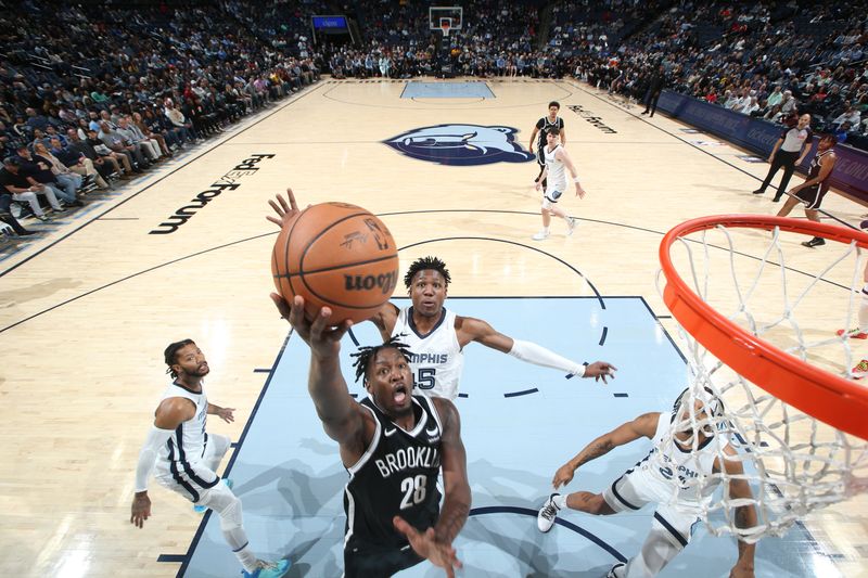 MEMPHIS, TN - February 26:  Dorian Finney-Smith #28 of the Brooklyn Nets drives to the basket during the game against the Memphis Grizzlies on February 26, 2024 at FedExForum in Memphis, Tennessee. NOTE TO USER: User expressly acknowledges and agrees that, by downloading and or using this photograph, User is consenting to the terms and conditions of the Getty Images License Agreement. Mandatory Copyright Notice: Copyright 2024 NBAE (Photo by Joe Murphy/NBAE via Getty Images)