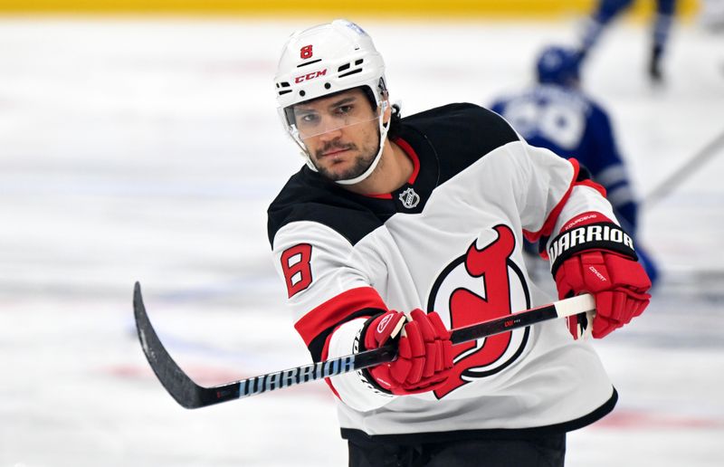 Jan 16, 2025; Toronto, Ontario, CAN;  New Jersey Devils defenseman Johnathan Kovacevic (8) warms up before playing the Toronto Maple Leafs at Scotiabank Arena. Mandatory Credit: Dan Hamilton-Imagn Images