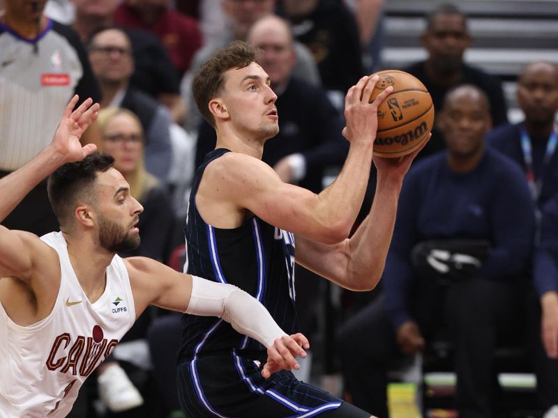 CLEVELAND, OH - APRIL 22: Franz Wagner #22 of the Orlando Magic drives to the basket during the game against the Cleveland Cavaliers during Round 1 Game 2 of the 2024 NBA Playoffs on April 22, 2024 at Rocket Mortgage FieldHouse in Cleveland, Ohio. NOTE TO USER: User expressly acknowledges and agrees that, by downloading and/or using this Photograph, user is consenting to the terms and conditions of the Getty Images License Agreement. Mandatory Copyright Notice: Copyright 2024 NBAE (Photo by Lauren Leigh Bacho/NBAE via Getty Images)