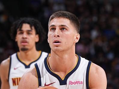 DENVER, CO - NOVEMBER 6: Collin Gillespie #21 of the Denver Nuggets shoots a free throw during the game against the New Orleans Pelicans on November 6, 2023 at the Ball Arena in Denver, Colorado. NOTE TO USER: User expressly acknowledges and agrees that, by downloading and/or using this Photograph, user is consenting to the terms and conditions of the Getty Images License Agreement. Mandatory Copyright Notice: Copyright 2023 NBAE (Photo by Garrett Ellwood/NBAE via Getty Images)