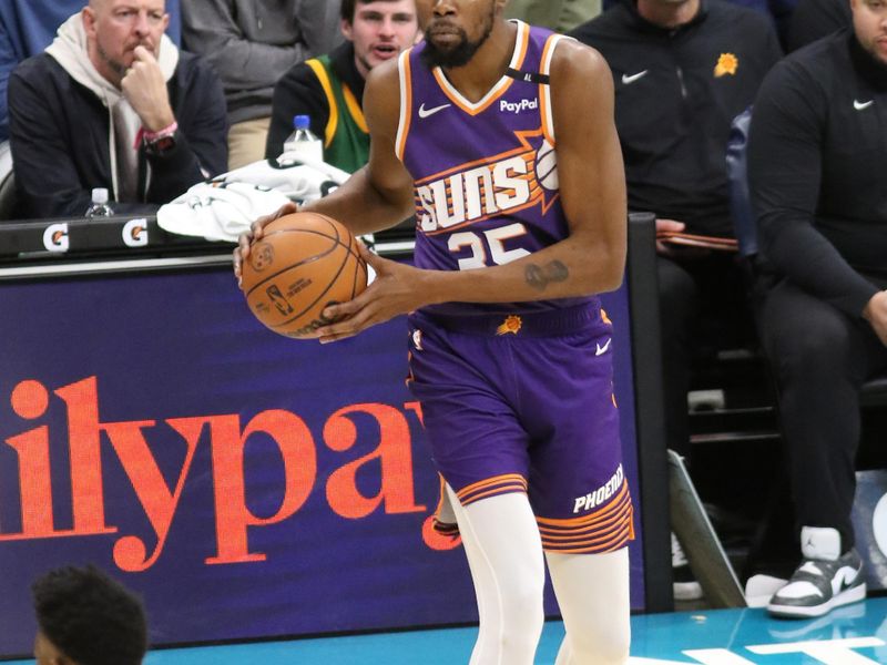 CHARLOTTE, NC - JANUARY 07: Kevin Durant #35 of the Phoenix Suns handles the ball during the game against the Charlotte Hornets on January 07, 2025 at Spectrum Center in Charlotte, North Carolina. NOTE TO USER: User expressly acknowledges and agrees that, by downloading and or using this photograph, User is consenting to the terms and conditions of the Getty Images License Agreement. Mandatory Copyright Notice: Copyright 2025 NBAE (Photo by Brock Williams-Smith/NBAE via Getty Images)