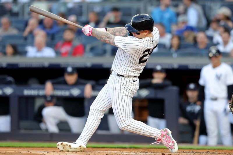 May 20, 2024; Bronx, New York, USA; New York Yankees left fielder Alex Verdugo (24) follows through on a two run double against the Seattle Mariners during the first inning at Yankee Stadium. Mandatory Credit: Brad Penner-USA TODAY Sports