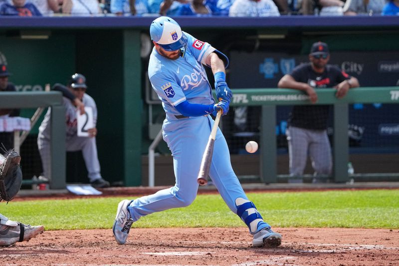 May 31, 2025; Kansas City, Missouri, USA; Kansas City Royals left fielder Nick Loftin (12) hits a single against the Detroit Tigers in the fifth inning at Kauffman Stadium. Mandatory Credit: Denny Medley-Imagn Images