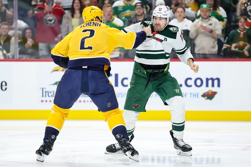 Nov 30, 2024; Saint Paul, Minnesota, USA; Minnesota Wild left wing Marcus Foligno (17) and Nashville Predators defenseman Luke Schenn (2) fight during the first period at Xcel Energy Center. Mandatory Credit: Matt Krohn-Imagn Images