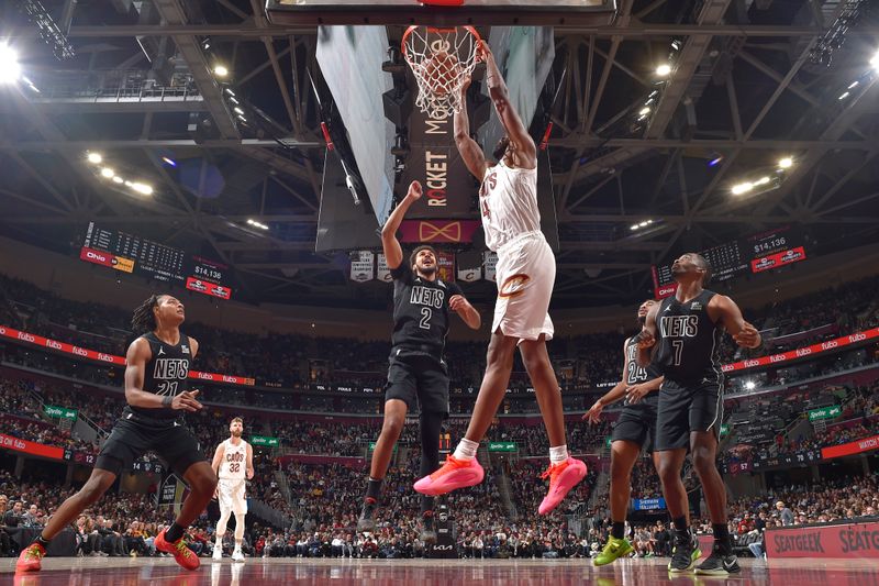 CLEVELAND, OH - NOVEMBER 9: Evan Mobley #4 of the Cleveland Cavaliers dunks the ball during the game against the Brooklyn Nets on November 9, 2024 at Rocket Mortgage FieldHouse in Cleveland, Ohio. NOTE TO USER: User expressly acknowledges and agrees that, by downloading and/or using this Photograph, user is consenting to the terms and conditions of the Getty Images License Agreement. Mandatory Copyright Notice: Copyright 2024 NBAE (Photo by David Liam Kyle/NBAE via Getty Images)