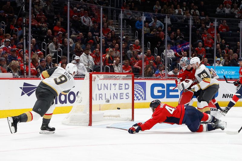 Oct 15, 2024; Washington, District of Columbia, USA; Vegas Golden Knights center Jack Eichel (9) scores a goal as Washington Capitals right wing Tom Wilson (43) defends in the second period at Capital One Arena. Mandatory Credit: Geoff Burke-Imagn Images