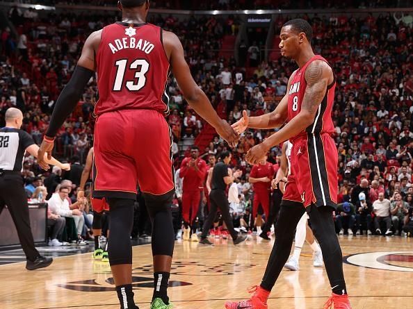 MIAMI, FL - DECEMBER 25:  Bam Adebayo #13 high fives Jamal Cain #8 of the Miami Heat during the game against the Philadelphia 76ers on December 25, 2023 at Kaseya Center in Miami, Florida. NOTE TO USER: User expressly acknowledges and agrees that, by downloading and or using this Photograph, user is consenting to the terms and conditions of the Getty Images License Agreement. Mandatory Copyright Notice: Copyright 2023 NBAE (Photo by David Sherman/NBAE via Getty Images)