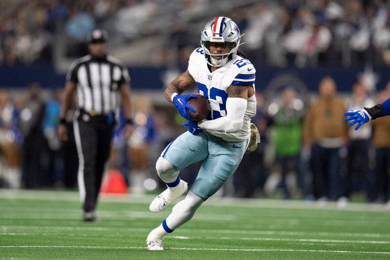 Dallas Cowboys running back Rico Dowdle runs with the ball during the first half of an NFL football game between the Dallas Cowboys and the New York Giants, Sunday, Nov. 12, 2023, in Arlington, Texas. The Cowboys won 49-17. (AP Photo/Julio Cortez)