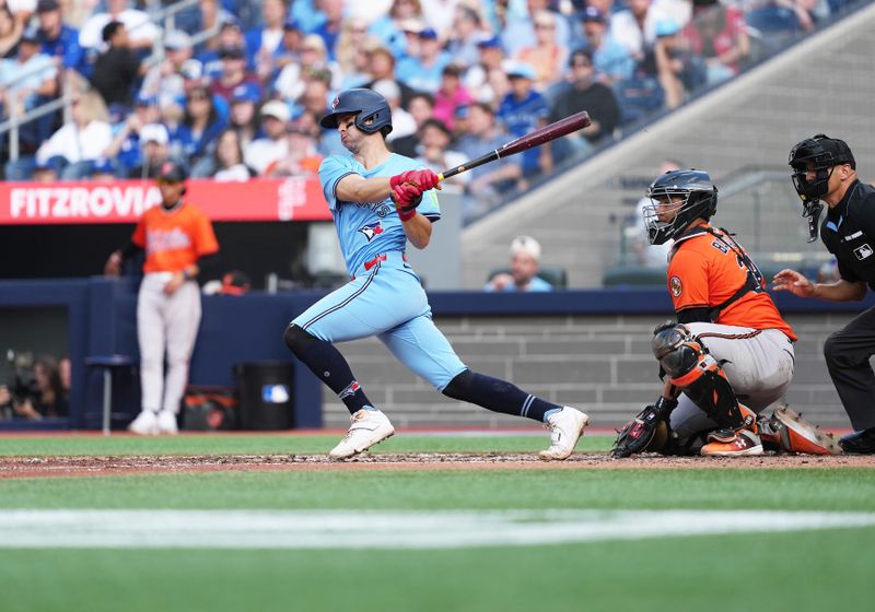 Sep 13, 2025; Toronto, Ontario, CAN; Toronto Blue Jays third baseman Ernie Clement (22) hits a single against the Baltimore Orioles during the eighth inning at Rogers Centre. Mandatory Credit: Nick Turchiaro-Imagn Images