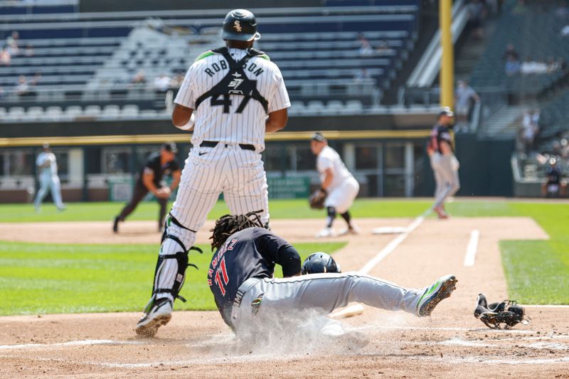 Sep 11, 2024; Chicago, Illinois, USA; Cleveland Guardians third baseman Jose Ramirez (11) scores against the Chicago White Sox during the first inning at Guaranteed Rate Field. Mandatory Credit: Kamil Krzaczynski-Imagn Images