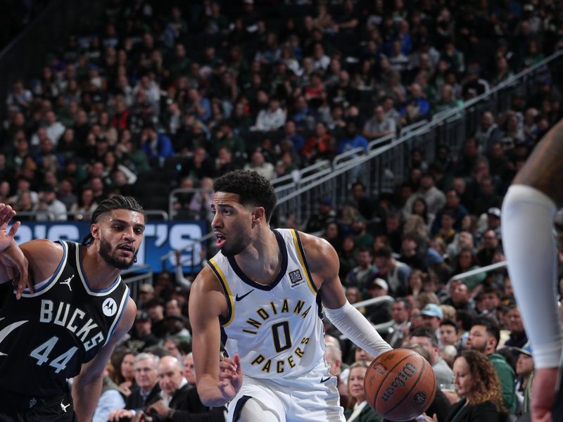 MILWAUKEE, WI - NOVEMBER 22: Tyrese Haliburton #0 of the Indiana Pacers dribbles the ball during the game against the Milwaukee Bucks  during a Emirates NBA Cup on November 22, 2024 at Fiserv Forum Center in Milwaukee, Wisconsin. NOTE TO USER: User expressly acknowledges and agrees that, by downloading and or using this Photograph, user is consenting to the terms and conditions of the Getty Images License Agreement. Mandatory Copyright Notice: Copyright 2024 NBAE (Photo by Gary Dineen/NBAE via Getty Images).