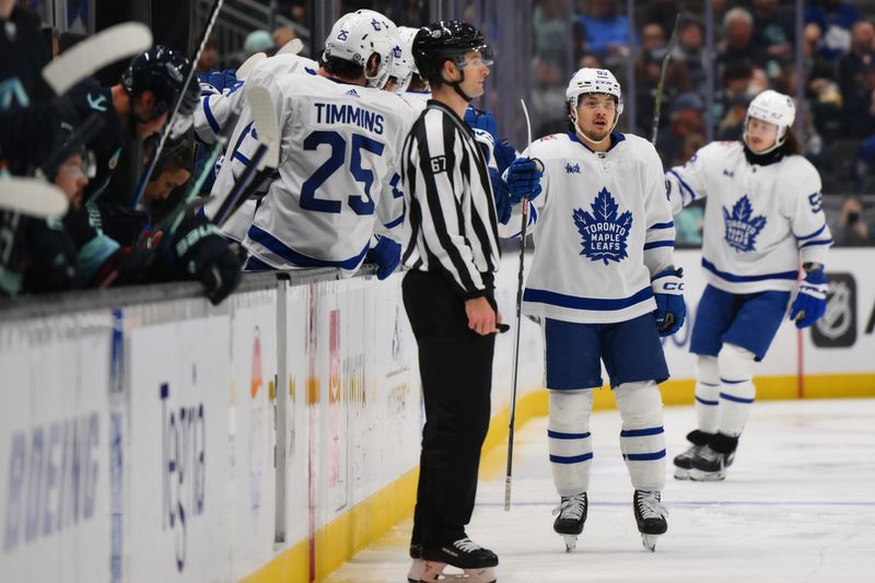 Jan 21, 2024; Seattle, Washington, USA; Toronto Maple Leafs left wing Nicholas Robertson (89) celebrates with the bench after scoring a goal against the Seattle Kraken during the second period at Climate Pledge Arena. Mandatory Credit: Steven Bisig-USA TODAY Sports