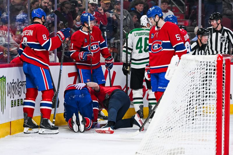 Nov 13, 2025; Montreal, Quebec, CAN; Montreal Canadiens center Alex Newhook (15) lays on the ice after being injured against the Dallas Stars during the second period at Bell Centre. Mandatory Credit: David Kirouac-Imagn Images