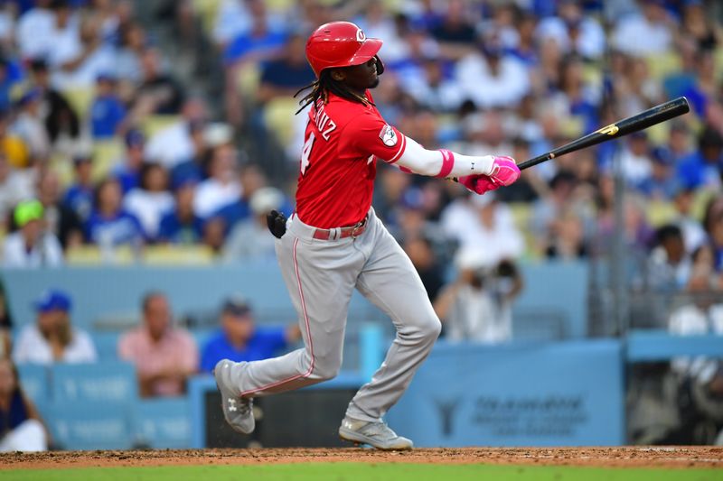 Jul 29, 2023; Los Angeles, California, USA; Cincinnati Reds shortstop Elly De La Cruz (44) hits a double against the Los Angeles Dodgers during the sixth inning at Dodger Stadium. Mandatory Credit: Gary A. Vasquez-USA TODAY Sports