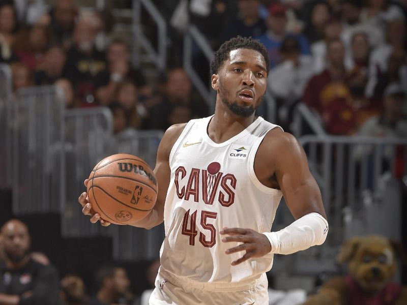 CLEVELAND, OH - APRIL 20: Donovan Mitchell #45 of the Cleveland Cavaliers brings the ball up court during Round 1 Game 1 of the 2024 NBA Playoffs against the Orlando Magic on April 20, 2024 at Rocket Mortgage FieldHouse in Cleveland, Ohio. NOTE TO USER: User expressly acknowledges and agrees that, by downloading and/or using this Photograph, user is consenting to the terms and conditions of the Getty Images License Agreement. Mandatory Copyright Notice: Copyright 2024 NBAE (Photo by David Liam Kyle/NBAE via Getty Images)