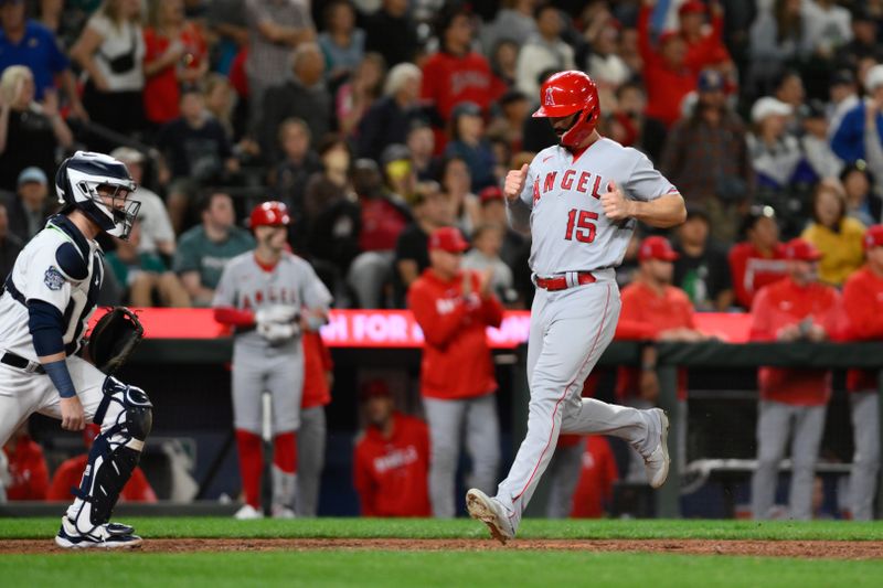 Sep 11, 2023; Seattle, Washington, USA; Los Angeles Angels left fielder Randal Grichuk (15) scores a run on a Seattle Mariners fielding error during the eleventh inning at T-Mobile Park. Mandatory Credit: Steven Bisig-USA TODAY Sports