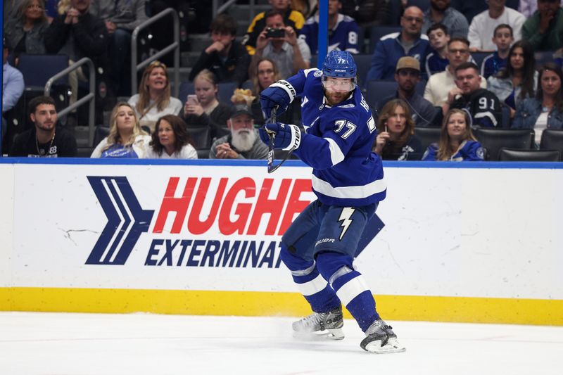 Mar 4, 2025; Tampa, Florida, USA; Tampa Bay Lightning defenseman Victor Hedman (77) shoots and scores a goal against the Columbus Blue Jackets in the second period at Amalie Arena. Mandatory Credit: Nathan Ray Seebeck-Imagn Images