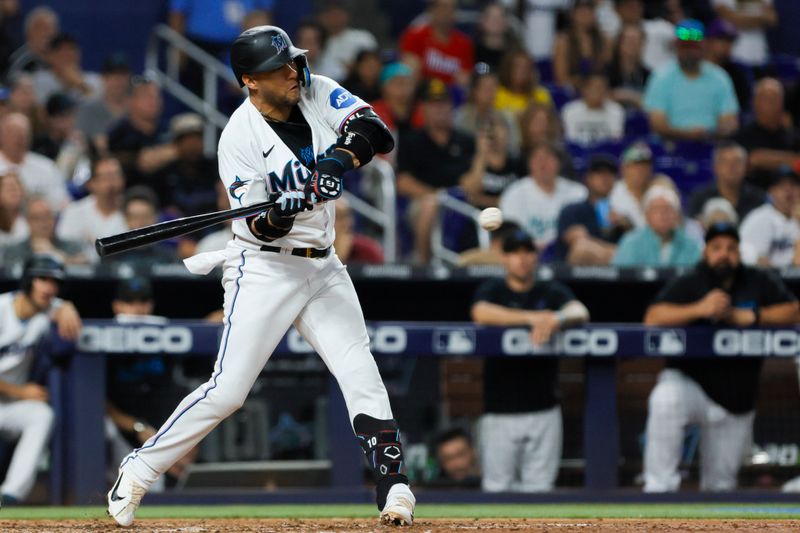 Jun 25, 2023; Miami, Florida, USA; Miami Marlins first baseman Yuli Gurriel (10) hits an RBI single against the Pittsburgh Pirates during the eighth inning at loanDepot Park. Mandatory Credit: Sam Navarro-USA TODAY Sports