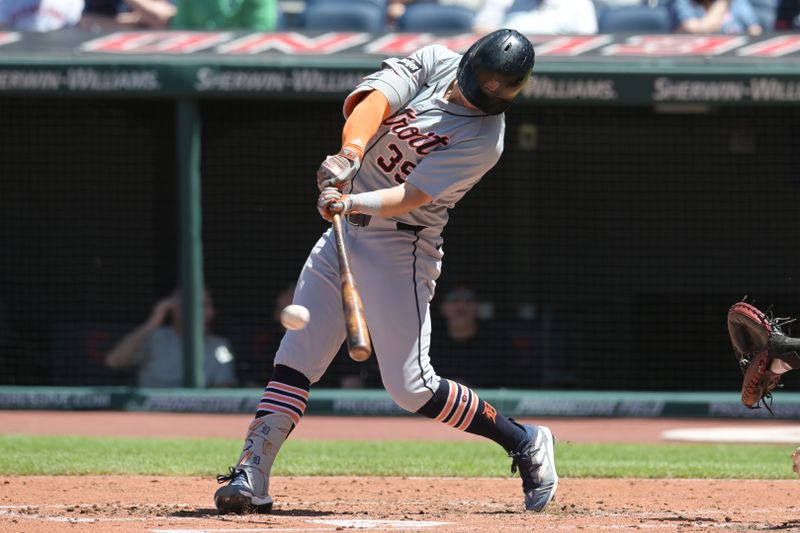 May 8, 2024; Cleveland, Ohio, USA; Detroit Tigers third baseman Zach McKinstry (39) hits a single during the third inning against the Cleveland Guardians at Progressive Field. Mandatory Credit: Ken Blaze-USA TODAY Sports