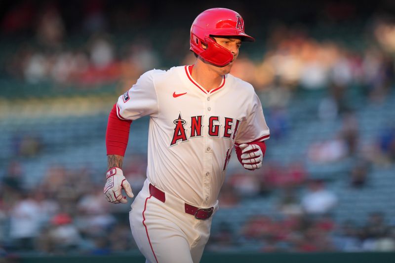 Jul 10, 2024; Anaheim, California, USA;  Los Angeles Angels center fielder Mickey Moniak (16) runs the bases after hitting a three-run home run in the second inning against the Texas Rangers at Angel Stadium. Mandatory Credit: Kirby Lee-USA TODAY Sports