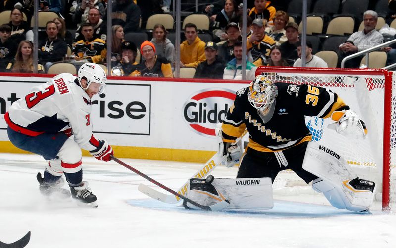 Mar 7, 2024; Pittsburgh, Pennsylvania, USA;  Pittsburgh Penguins goaltender Tristan Jarry (35) defends the net against Washington Capitals defenseman Nick Jensen (3) during the second period at PPG Paints Arena. Mandatory Credit: Charles LeClaire-USA TODAY Sports