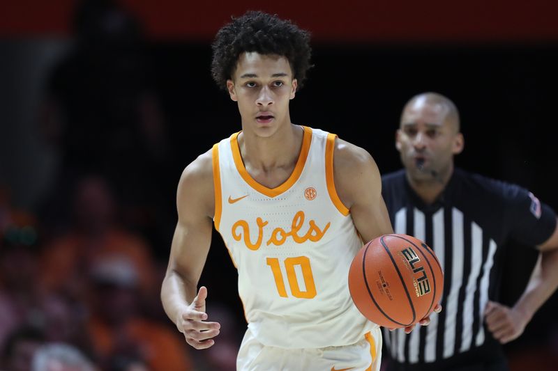 Feb 28, 2026; Knoxville, Tennessee, USA;  Tennessee Volunteers forward Nate Ament (10) brings the ball up court against the Alabama Crimson Tide during the first half at Thompson-Boling Arena at Food City Center. Mandatory Credit: Randy Sartin-Imagn Images