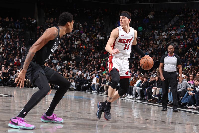 BROOKLYN, NY - JANUARY 15: Tyler Herro #14 of the Miami Heat dribbles the ball during the game against the Brooklyn Nets on January 15, 2024 at Barclays Center in Brooklyn, New York. NOTE TO USER: User expressly acknowledges and agrees that, by downloading and or using this Photograph, user is consenting to the terms and conditions of the Getty Images License Agreement. Mandatory Copyright Notice: Copyright 2024 NBAE (Photo by Nathaniel S. Butler/NBAE via Getty Images)