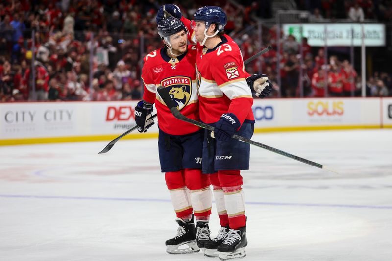 Jan 15, 2024; Sunrise, Florida, USA; Florida Panthers center Carter Verhaeghe (23) celebrates with center Sam Reinhart (13) after scoring against the Anaheim Ducks during the second period at Amerant Bank Arena. Mandatory Credit: Sam Navarro-USA TODAY Sports