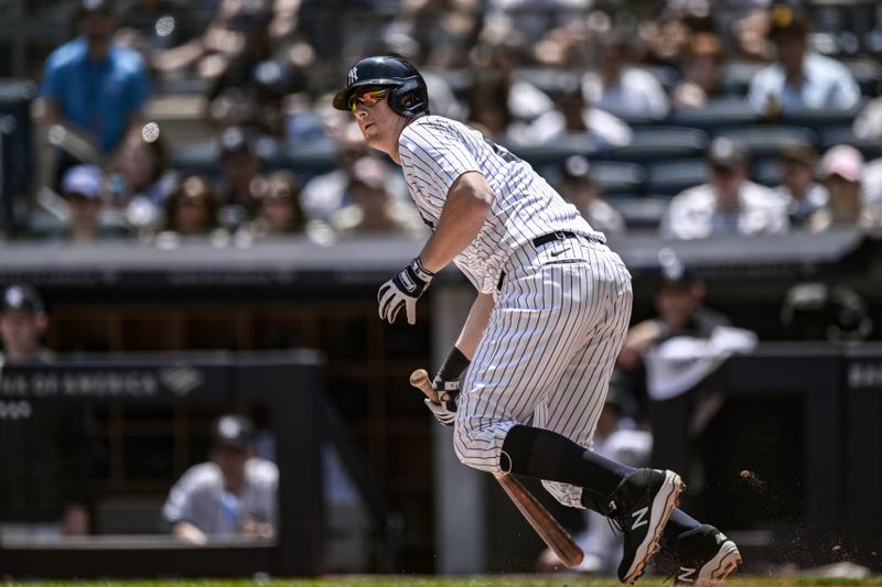 May 27, 2023; Bronx, New York, USA; New York Yankees third baseman DJ LeMahieu (26) hits a RBI double against the San Diego Padres during the first inning at Yankee Stadium. Mandatory Credit: John Jones-USA TODAY Sports