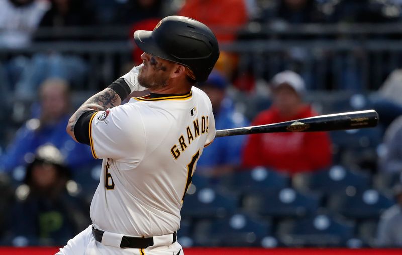 May 11, 2024; Pittsburgh, Pennsylvania, USA; Pittsburgh Pirates catcher Yasmani Grandal (6) hits a three run home run against the Chicago Cubs during the fifth inning at PNC Park. Mandatory Credit: Charles LeClaire-USA TODAY Sports