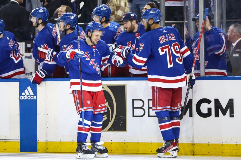 May 5, 2024; New York, New York, USA; New York Rangers left wing Artemi Panarin (10) celebrates with defenseman K'Andre Miller (79) after scoring a goal in the third period against the Carolina Hurricanes in game one of the second round of the 2024 Stanley Cup Playoffs at Madison Square Garden. Mandatory Credit: Wendell Cruz-USA TODAY Sports