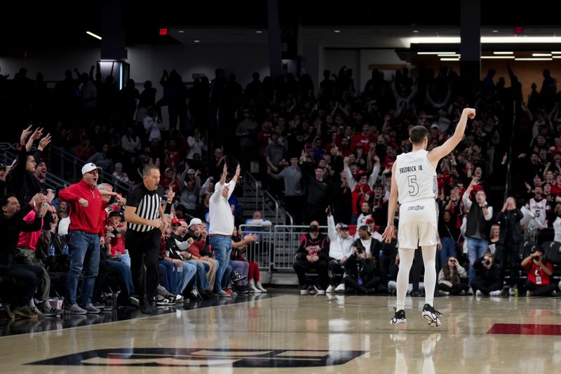 Jan 18, 2025; Cincinnati, Ohio, USA;  Cincinnati Bearcats guard CJ Fredrick Jr. (5) reacts to making a 3-point shot against the Arizona State Sun Devils in the second half at Fifth Third Arena. Mandatory Credit: Aaron Doster-Imagn Images