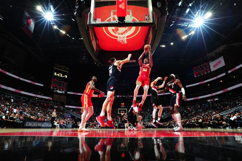 ATLANTA, GA - MARCH 3: De'Andre Hunter #12 of the Atlanta Hawks drives to the basket during the game against the Portland Trail Blazers on March 3, 2023 at State Farm Arena in Atlanta, Georgia.  NOTE TO USER: User expressly acknowledges and agrees that, by downloading and/or using this Photograph, user is consenting to the terms and conditions of the Getty Images License Agreement. Mandatory Copyright Notice: Copyright 2023 NBAE (Photo by Scott Cunningham/NBAE via Getty Images)