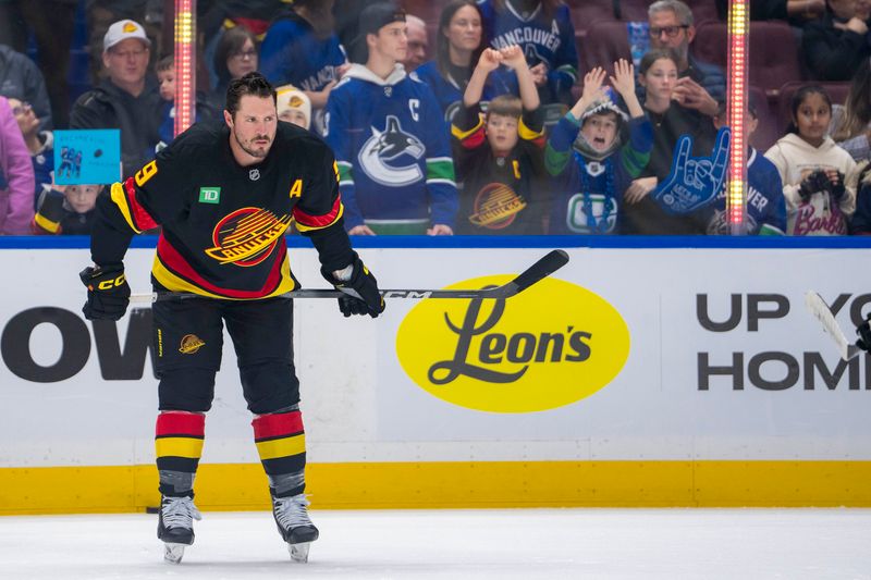 Nov 9, 2024; Vancouver, British Columbia, CAN; Vancouver Canucks forward J.T. Miller (9) rests during warm up prior to a game against the Edmonton Oilers at Rogers Arena. Mandatory Credit: Bob Frid-Imagn Images