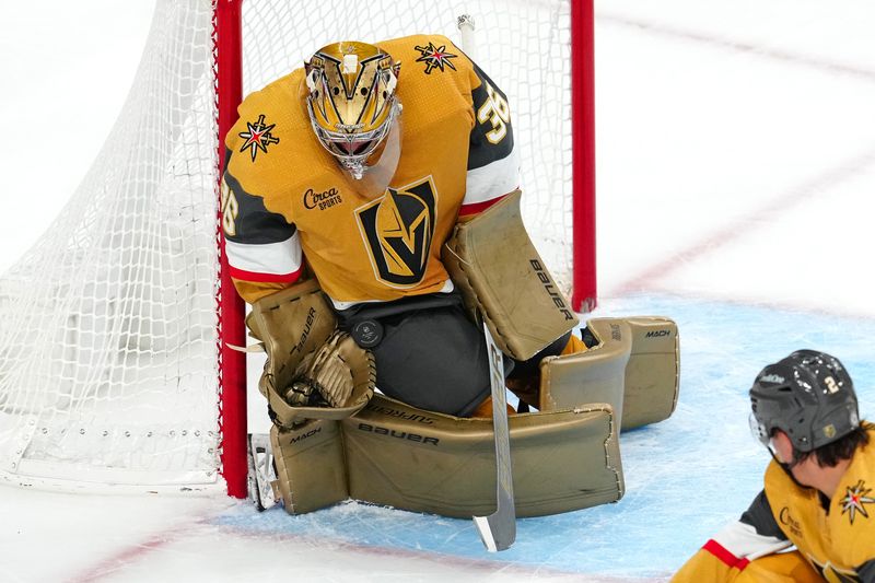 Nov 25, 2023; Las Vegas, Nevada, USA; Vegas Golden Knights goaltender Logan Thompson (36) makes a save against the Arizona Coyotes during the third period at T-Mobile Arena. Mandatory Credit: Stephen R. Sylvanie-USA TODAY Sports