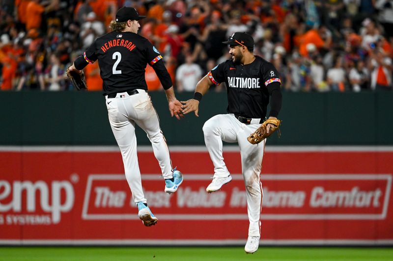 Jun 29, 2024; Baltimore, Maryland, USA;  Baltimore Orioles shortstop Gunnar Henderson (2)] and  outfielder Anthony Santander (25) celebrate after the game Texas Rangers at Oriole Park at Camden Yards. Mandatory Credit: Tommy Gilligan-USA TODAY Sports