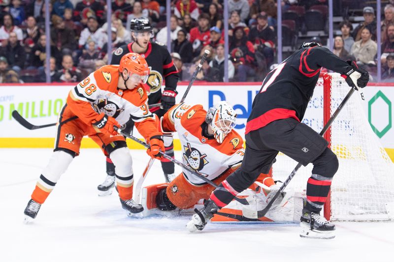 Mar 14, 2026; Ottawa, Ontario, CAN; Anaheim Ducks goalie Ville Husso (33) makes a save on a shot from Ottawa Senators left wing Warren Foegele (37) in the first period at the Canadian Tire Centre. Mandatory Credit: Marc DesRosiers-IMAGN Images
