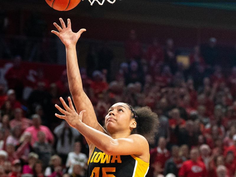 Feb 11, 2024; Lincoln, Nebraska, USA; Iowa Hawkeyes forward Hannah Stuelke (45) shoots the ball against the Nebraska Cornhuskers during the fourth quarter at Pinnacle Bank Arena. Mandatory Credit: Dylan Widger-USA TODAY Sports