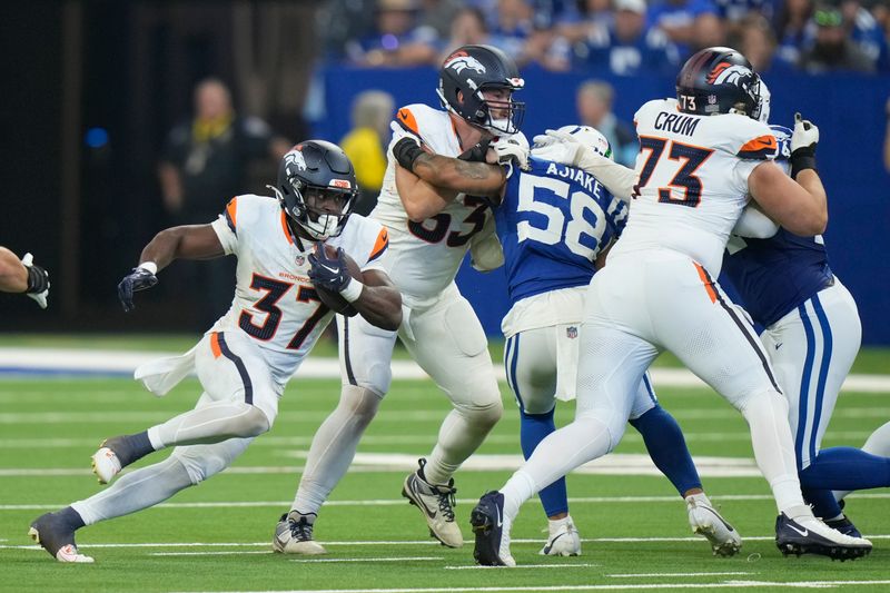 Denver Broncos running back Audric Estime (37) carries the ball against the Indianapolis Colts during the second half of a preseason NFL football game, Sunday, Aug. 11, 2024, in Westfield, Ind. (AP Photo/AJ Mast)