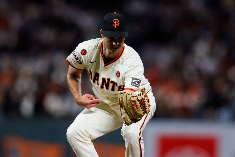 Aug 12, 2024; San Francisco, California, USA; San Francisco Giants pitcher Tyler Rogers (71) catches a line drive during the eighth inning against the Atlanta Braves at Oracle Park. Mandatory Credit: Sergio Estrada-USA TODAY Sports