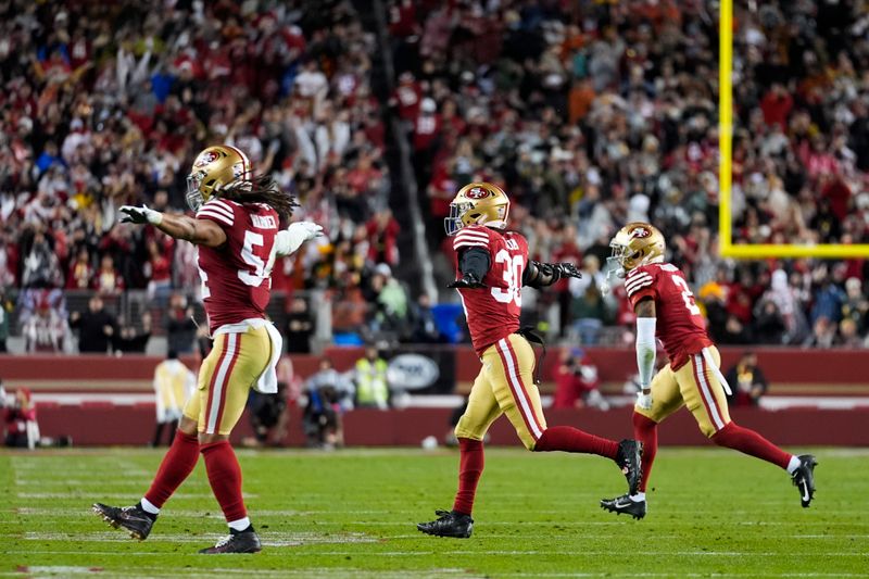 San Francisco 49ers linebacker Fred Warner (54), safety George Odum (30) and cornerback Deommodore Lenoir (2) react to a missed field goal attempt by the Green Bay Packers during an NFL football game Sunday, Jan. 21, 2024, in Santa Clara, Calif. (AP Photo/Ashley Landis)