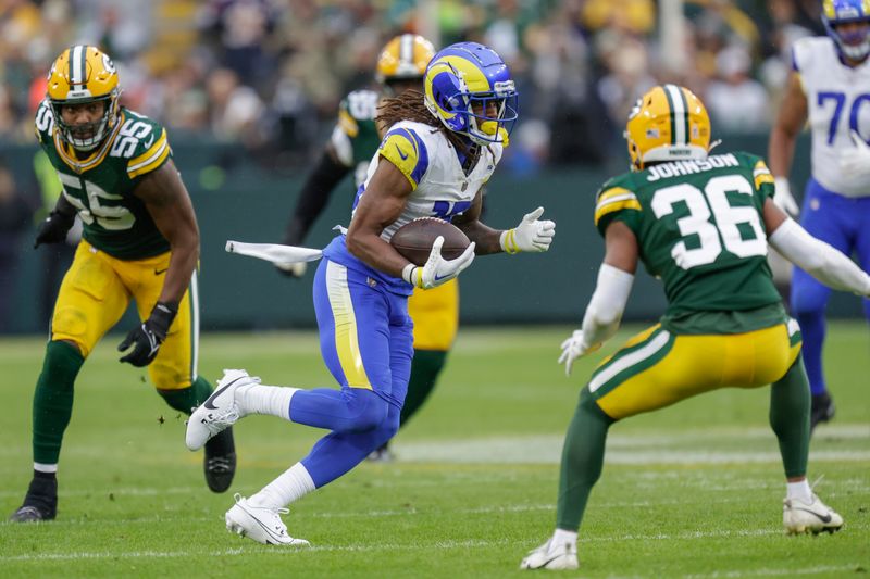 Los Angeles Rams wide receiver Demarcus Robinson (15) runs after making a catch during an NFL football game between the Green Bay Packers and Los Angeles Rams Sunday, Nov. 5, 2023, in Green Bay, Wis. (AP Photo/Matt Ludtke)