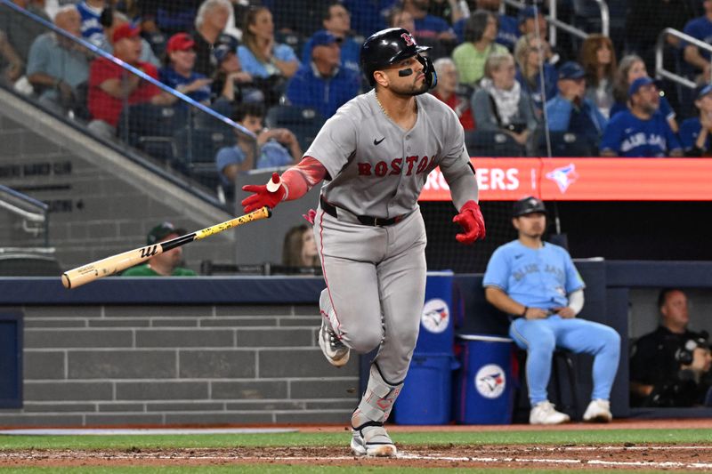 Sep 24, 2025; Toronto, Ontario, CAN;  Boston Red Sox catcher Carlos Narvaez (75) hits a three-run home run against the Toronto Blue Jays in the eighth inning at Rogers Centre. Mandatory Credit: Dan Hamilton-Imagn Images