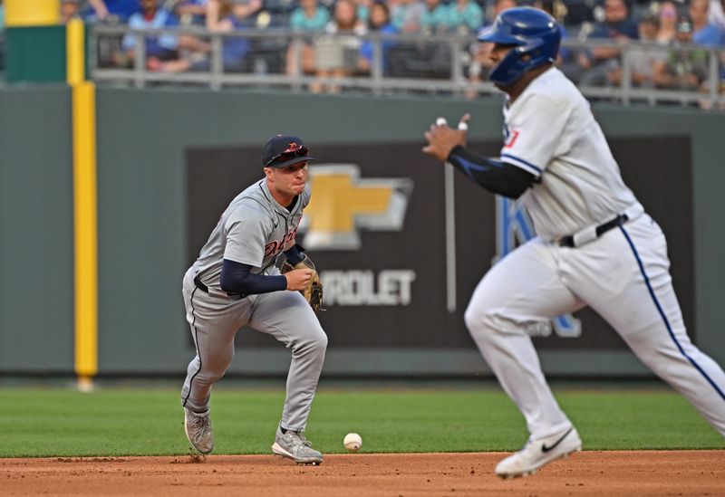 May 21, 2024; Kansas City, Missouri, USA;  Detroit Tigers second baseman Colt Keith (33) runs after a misplayed ground ball, as Kansas City Royals Salvador Perez (13) advances to second base in the first inning at Kauffman Stadium. Mandatory Credit: Peter Aiken-USA TODAY Sports