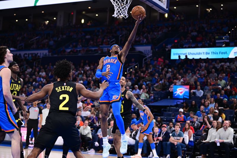 OKLAHOMA CITY, OKLAHOMA - MARCH 20: Shai Gilgeous-Alexander lays up a shot at the basket during the second half against the Utah Jazz at Paycom Center on March 20, 2024 in Oklahoma City, Oklahoma. NOTE TO USER: User expressly acknowledges and agrees that, by downloading and or using this Photograph, user is consenting to the terms and conditions of the Getty Images License Agreement. (Photo by Joshua Gateley/Getty Images)